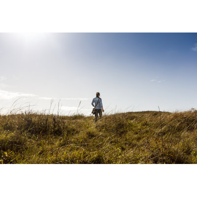 Woman Walking on Meadow by Mafelipe