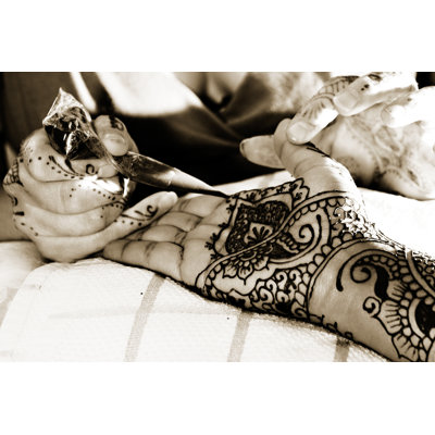 Putting On Henna - Wrapped Canvas Print