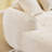 Beige chenille L-shaped compressed sofa that goes well with any living room. It features high-elastic sponge for a comfortable sitting feel,  curved armrests and four throw pillows.-853631729