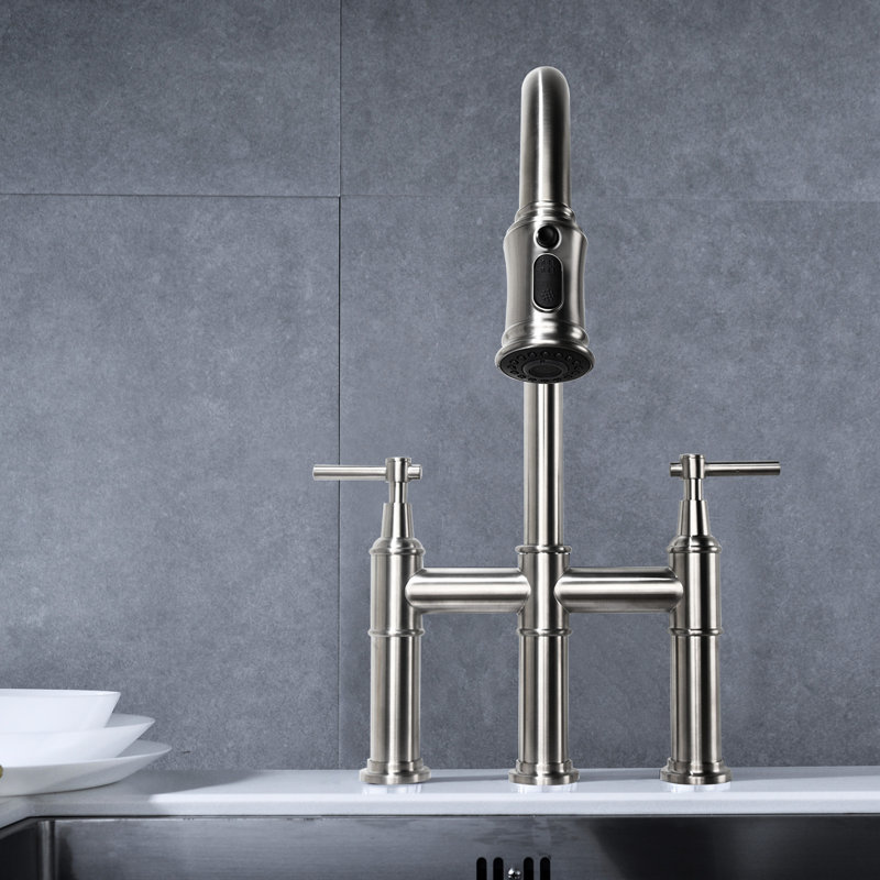 Bridge Kitchen Faucet With Brushed Nickel Finish. Pull-Down And Dual Handle For Convenient Usage. 360-Degree Rotating High Nozzle More Sink Space. Made Of Brass. Silent Splash- Water Flow Enhancer.