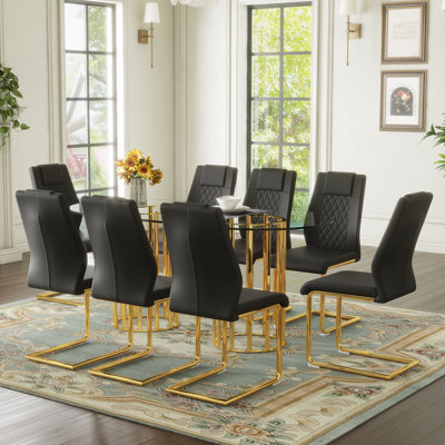 Ensemble de table et de chaises Table de salle à manger ovale en verre trempé de 71 pouces, double colonne dorée de luxe de style luxueux, chaises en polyuréthane noir de haute qualité avec pieds en métal arqués dorés, table moderne et ensemble de meubles 8 places.