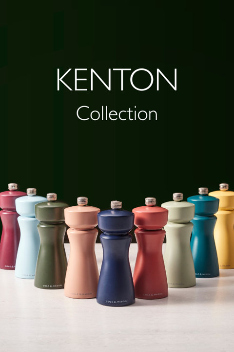 Kenton Collection featuring an assortment of colorful Cole and Mason salt and pepper mills arranged on a white surface against a dark background.