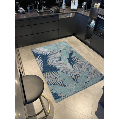 Tapis décoratif bleu à motif floral multicolore