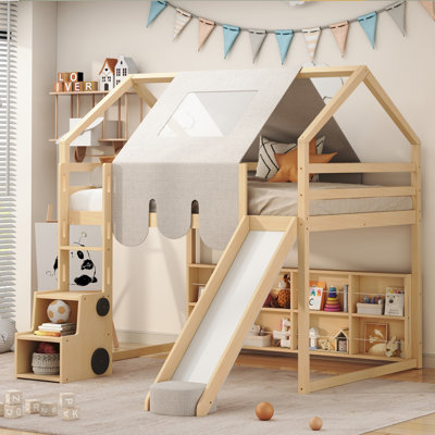 Lit mezzanine en bois avec structure en forme de maison et tente