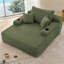 Chaise longue convertible avec accoudoirs larges et coussins décoratifs