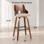 Tabouret de bar à hauteur fixe avec pivot en bois de noyer, tissu beige et repose-pieds carré en métal noir - ensemble de 2