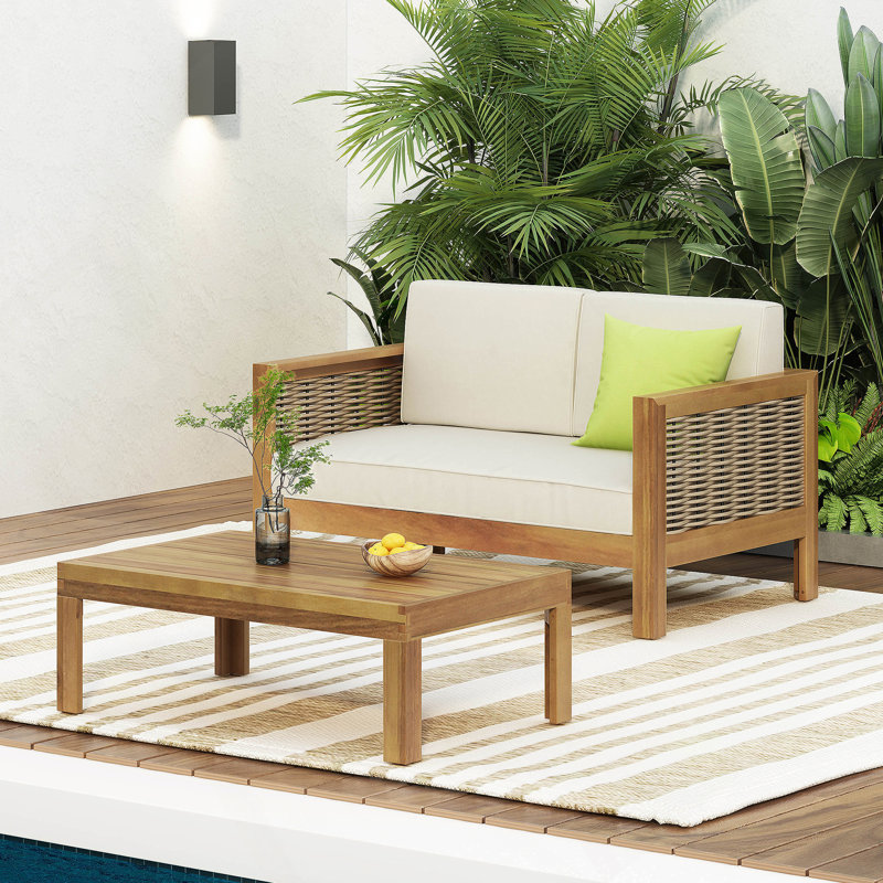 Ensemble de causeuse et table basse d'extérieur en bois d'acacia et osier avec coussins, teck et beige