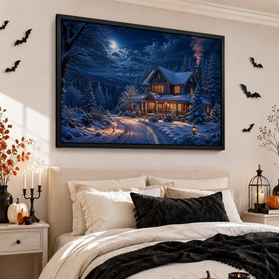 Tableau mural sur toile représentant un chalet enneigé avec de la fumée de cheminée et une décoration d'Halloween