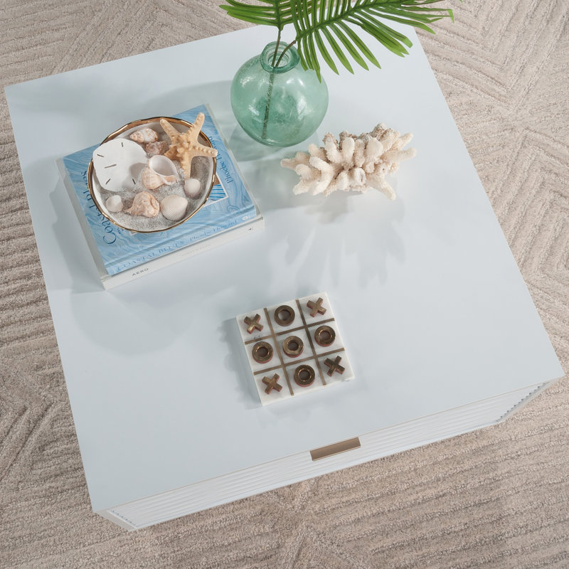 Élégante table basse blanche avec plateau spacieux et deux tiroirs, parfaite pour la vie moderne et les solutions de rangement.
