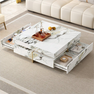 Table basse carrée avec texture en marbre 4 tiroirs, 43,3 pouces, panneau de fibres à densité moyenne blanc doux, base à piédestal suspendu