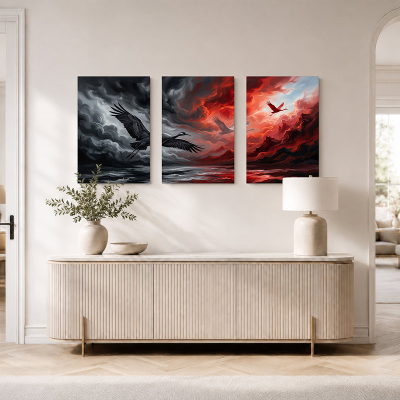 Ensemble de 3 grues noires et blanches survolant un ciel gris orageux et rouge vif, H 36 po x l 24 po x 3 pièces