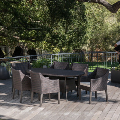 Arant Oval 6 - Person 69" Long Dining Set with Cushions