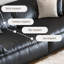 Causeuse-coussin modulable noire en cuir véritable
