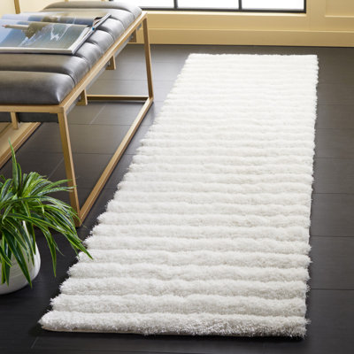 Tapis de couleur unie à poils longs performance touffeté à la main Wyler