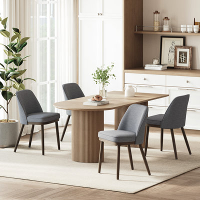 Chaise de salle à manger rembourrée moderne avec dossier courbé et pieds en bois massif