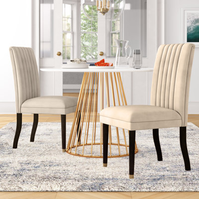 Chaise parsons rembourrée en velours Antonella