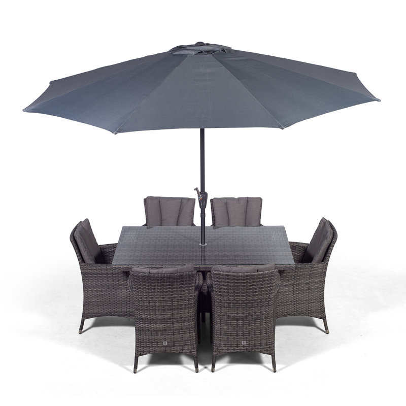 Karcher 6 - Person Wicker Patio Dining Set with Rectangular Table , Cushions Included
