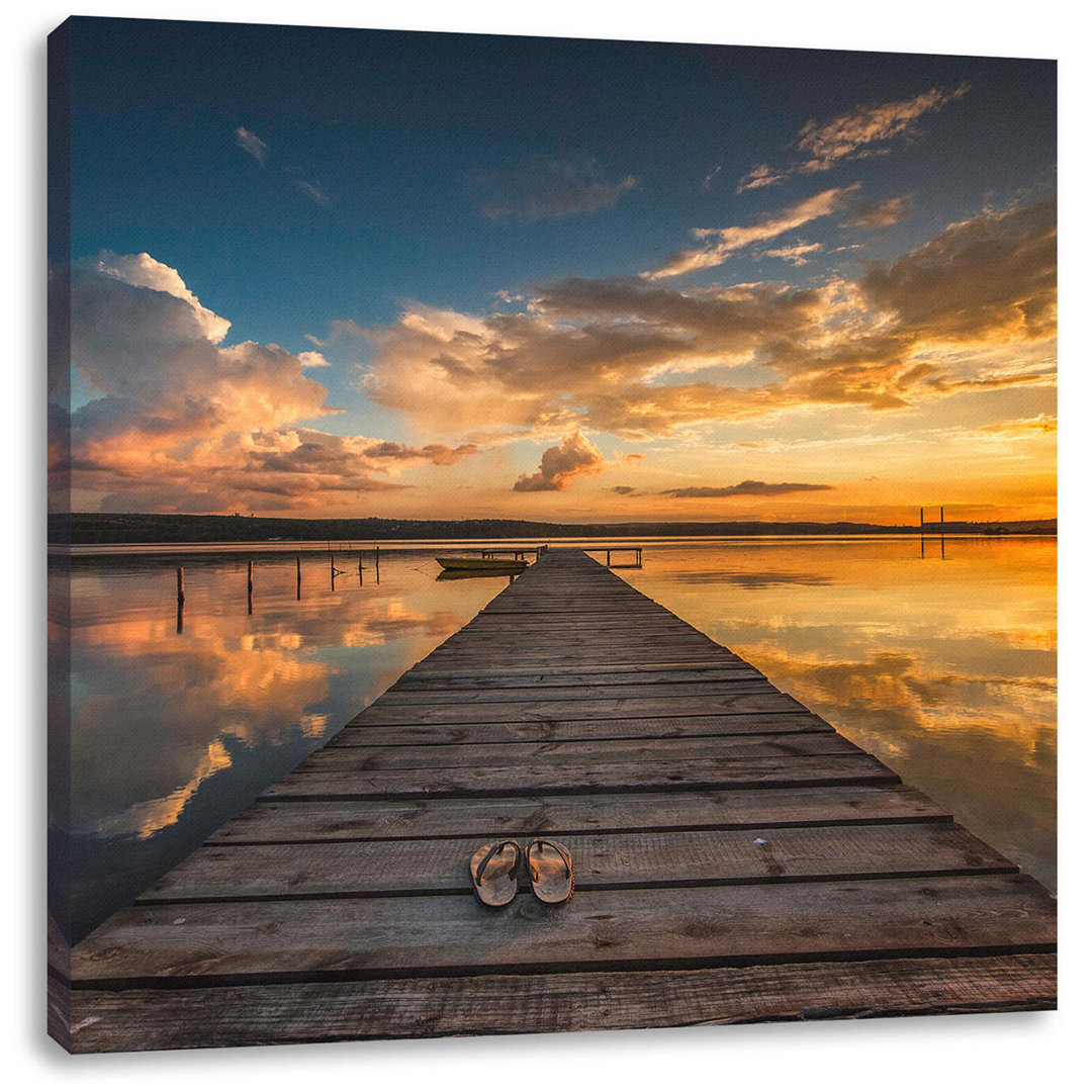 Leinwandbild Fußgängerbrücke am See bei Sonnenuntergang