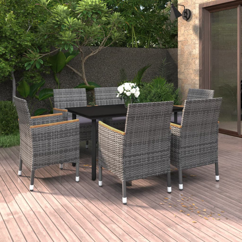 Ensemble de salle à manger de jardin noir avec chaises grises et coussins gris foncé