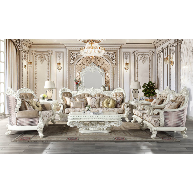 Antique White Tufted Sofa with Floral Cushions and Nailhead Trim