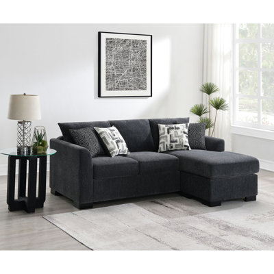 Canapé d'angle convertible gris foncé avec accoudoirs arrondis, siège à ressorts ensachés et quatre coussins décoratifs contemporains - Configuration