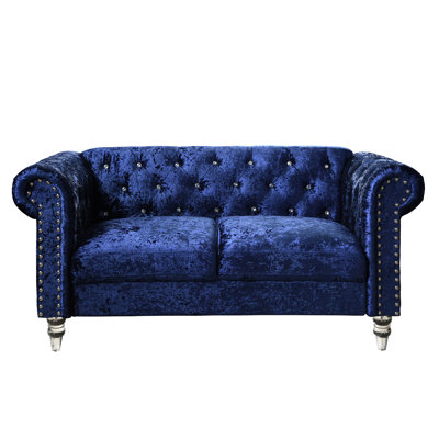 Causeuse en velours bleu