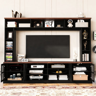 Meuble télé de 243 cm de large pour téléviseurs de 203 cm, meuble télé moderne avec portes en verre trempé, plusieurs étagères, et possibilité d'incliner votre espace de vie vers le haut grâce à ce meuble mural. Comprend du rangement pour console multimédia et un câblage apparent.