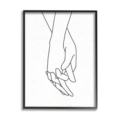 Romantiques mains tenant le dessin d'un couple d'amoureux