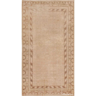 Tapis Khotan antique doux et délavé