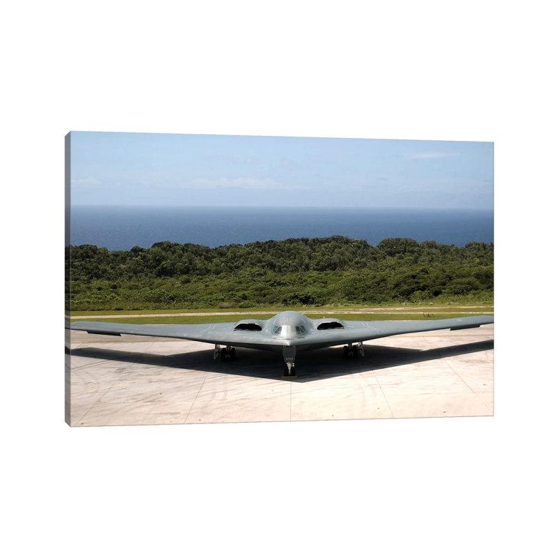 A B-2 Spirit Stealth Bomber Waits On The Flightline - Wrapped Canvas Print, 30.48 cm H x 45.72 cm W