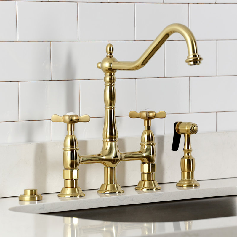 Kingston Brass Bel-Air Two-Handle 4-Hole Deck Mount Bridge Kitchen Faucet with Brass Side Sprayer, Brushed Brass, Cross