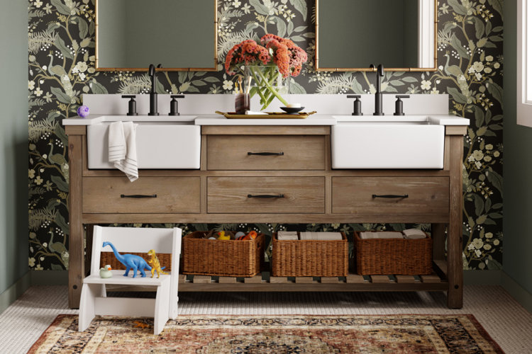 dark green bathroom with a wood double vanity, farmhouse sinks, and a vintage-inspired area rug