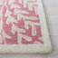 Tapis rose / ivoire en laine touffeté à la main Jashona-63493171