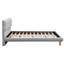 Lit plateforme gris avec tête de lit en forme de biscuit, fabriqué en matériaux robustes pour la durabilité