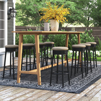 Coggeshall Swivel Patio Bar Stool with Cushion by Three Posts