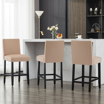 Tabouret de bar rembourré avec structure en bois massif