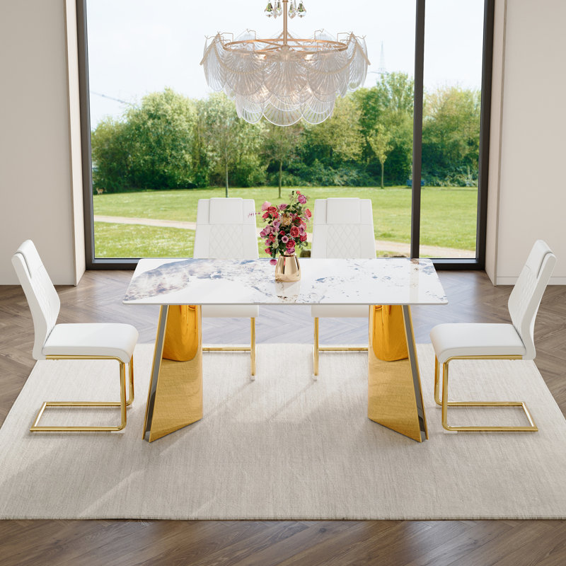 Ensemble de table de salle à manger luxueux Pandora avec pieds papillon dorés et chaises en polyuréthane blanc