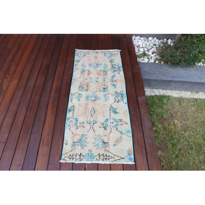 Vintage Turkish Door Mat Featuring A Handmade Wool Rug With Soft Pastel Tones And An Exquisite Floral Design