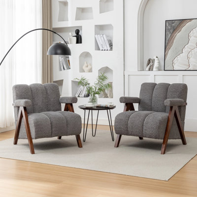 Fauteuil Dormon rembourré avec pieds en bois massif
