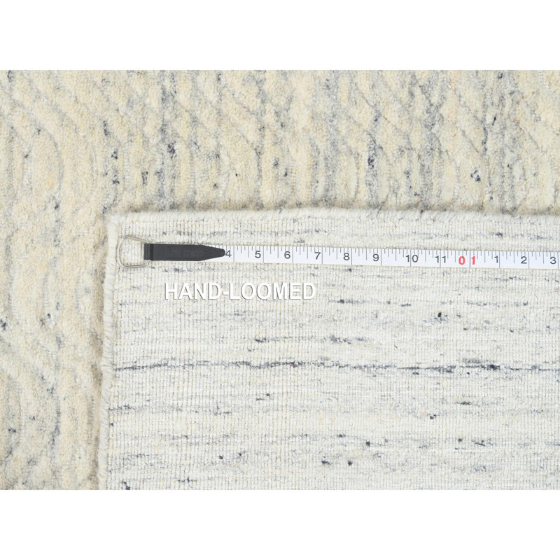 Tapis beige en laine 5 pi 10 po x 9 pi