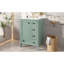Meuble-lavabo vert clair compact avec lavabo en céramique, design moderne