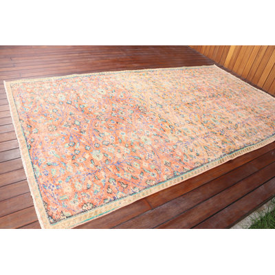 Handmade Vintage Orange Turkish Rug With Floral Pattern Ideal For Enhancing Your Living Room Or Boho Home Decor