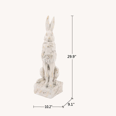 Grande figurine de lapin assis en magnésium avec finition blanche antique et base piédestal élégante, parfaite pour un décor rétro