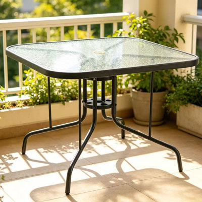 Table de salle à manger de patio avec plateau en verre trempé