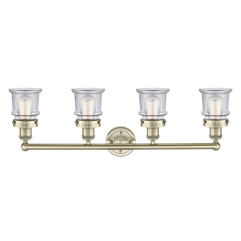 Petit luminaire pour salle de bain 4 lumières Cailen de la collection Edison, Transparent, Laiton antique