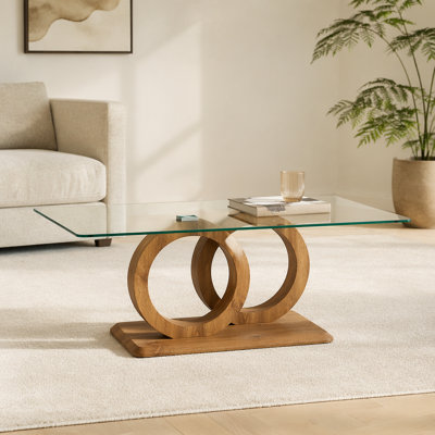 Une table basse rectangulaire moderne et tendance avec un plateau en verre trempé et des pieds en grain de bois. Convient au salon: 47,2 po x 25,4 po x 17,9 po