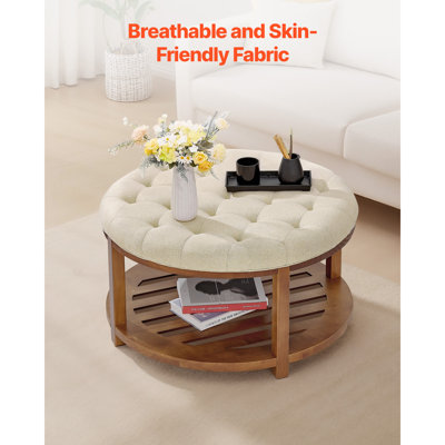 Grande table basse ronde avec repose-pieds intégré, capitonnée, de 81 cm (31,9 pouces), avec étagère de rangement en bois massif, supportant jusqu'à 159 kg (350 lb). Revêtement en lin massif. Couleur de lin.