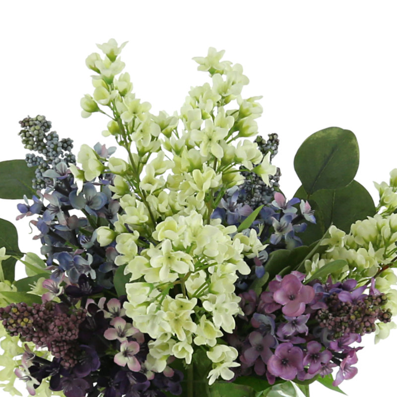 Lilac, Bouvardia And Eucalyptus Floral Arrangement In A Round Glass Vase