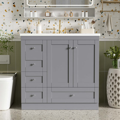 Meuble-lavabo autoportant de 36 po de style Shaker avec lavabo en résine intégré, quatre tiroirs à fermeture en douceur, deux portes à fermeture en douceur et rangement bien pensé.
