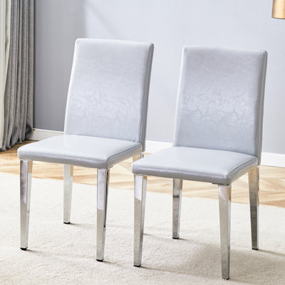 Deux chaises de salle à manger en polyuréthane gris clair (seulement les chaises)